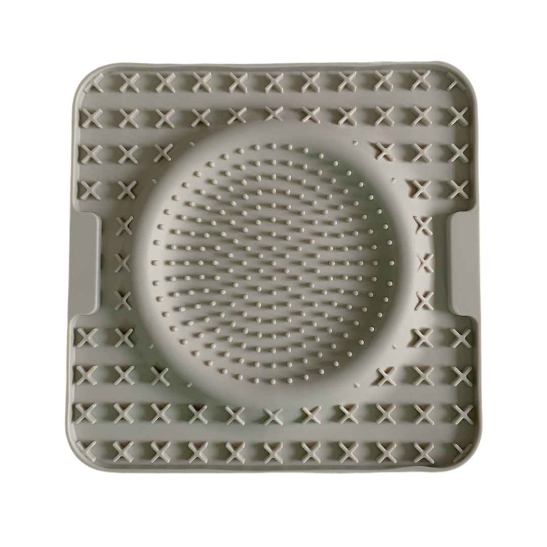 Grey silicone dog lick mat with raised textures for enrichment and mental stimulation by Paws In Earnest
